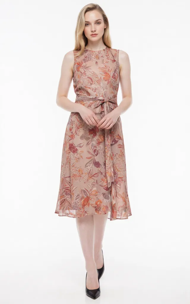 A French female model wearing Retro   style clothing, against a white background, in a front   facing shot focusing on shoes